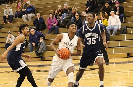 Shay Nelson drives for two defended by Jihad Warner of PSU Mont Alto in Monday night's win.