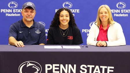 Cardinal Spellman's Arielle Ramirez joined by Head Softball Coach Rich Lipinski and Director of Athletics Patrice Lombard during a signing ceremony at Penn State Hazleton.